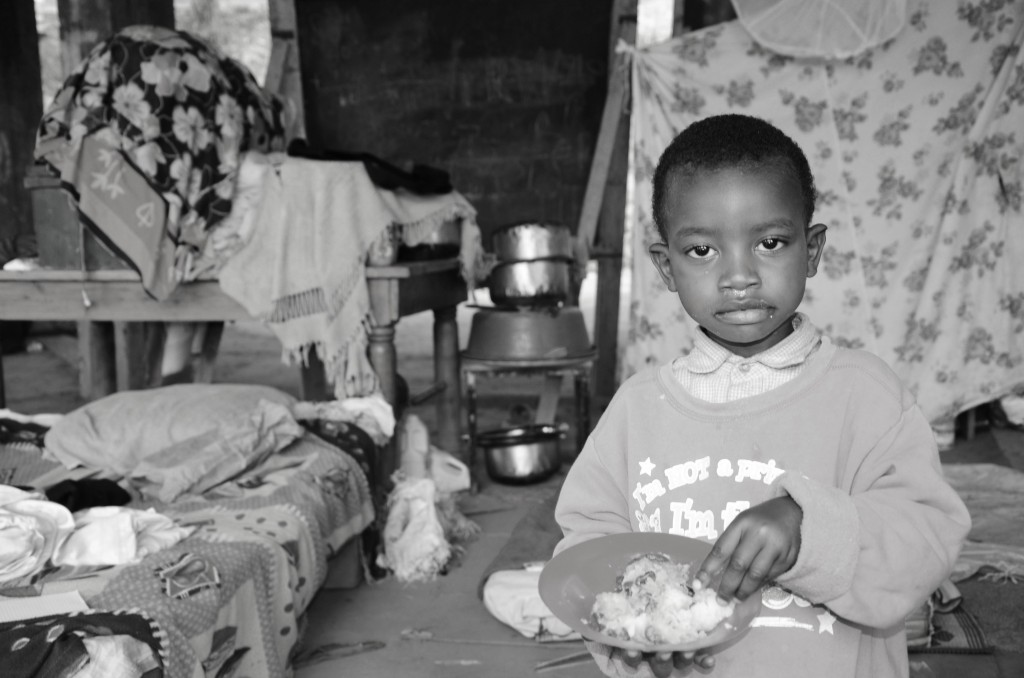 Child in Kosovo after heavy rain that made their parents to be homeless