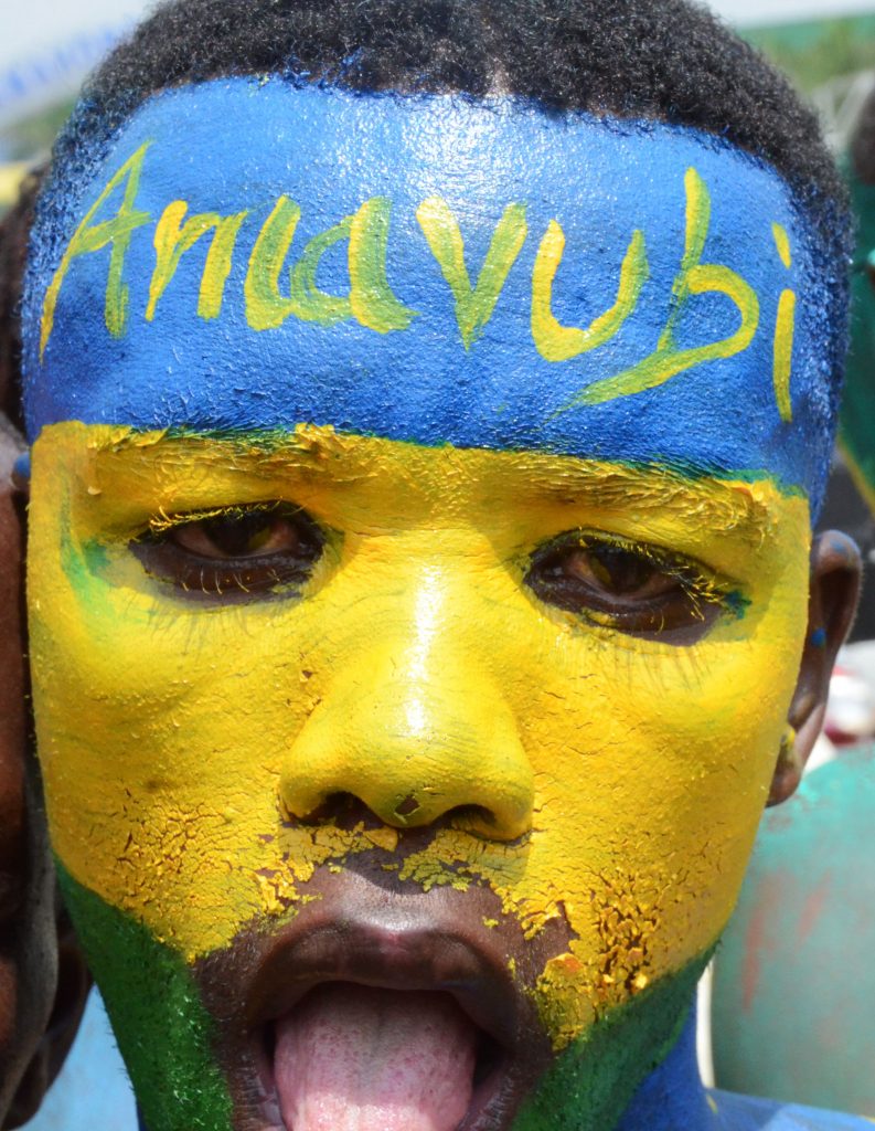 Amavubi fan in National flag colors on their way to the stadium