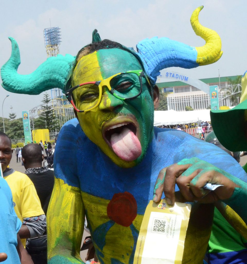 Amavubi fan in National flag colors on their way to the stadium