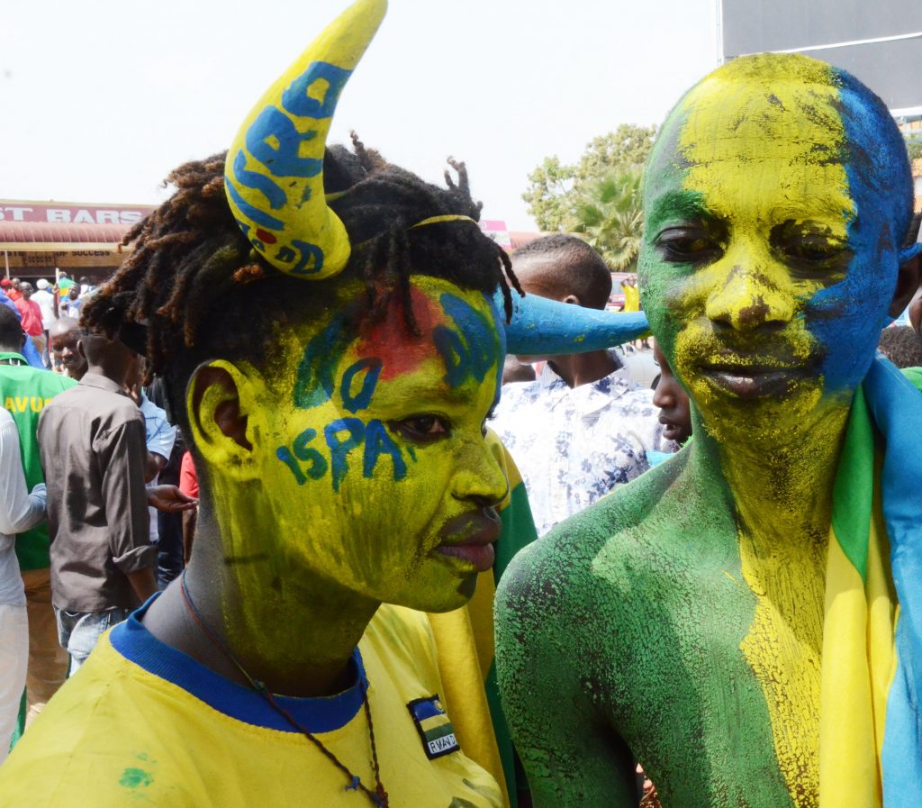 Amavubi fan in National flag colors on their way to the stadium