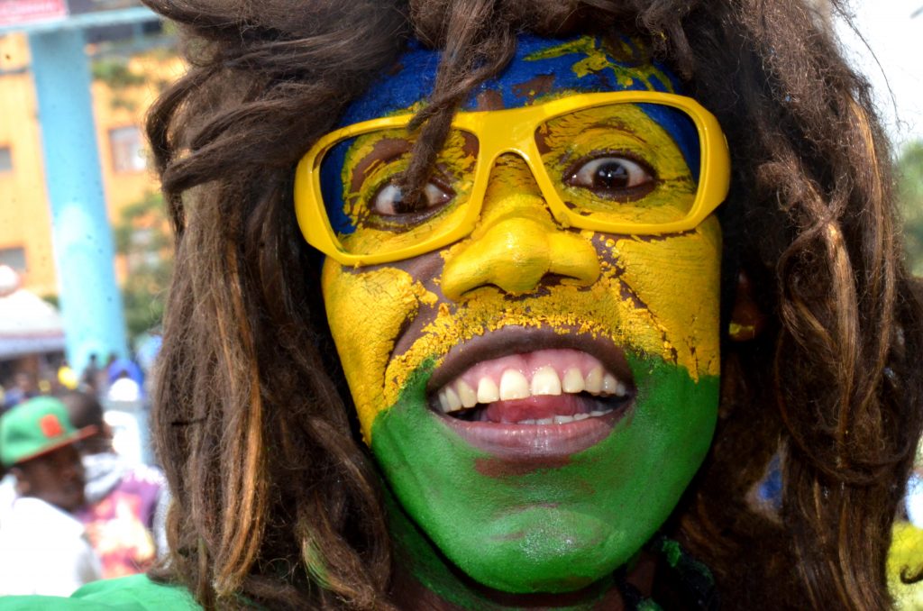 Amavubi fan in National flag colors on their way to the stadium