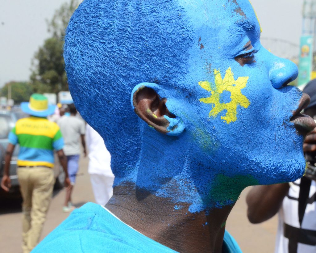 Amavubi fan in National flag colors on their way to the stadium
