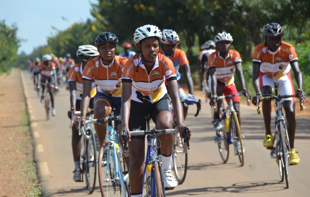 Race to remember gathers three distinctive categories of riders. Female riders, junior riders and senior riders. this photo highlights two girls who are emerging to join Jean d'Arc who has been experiencing cycling over Africa.