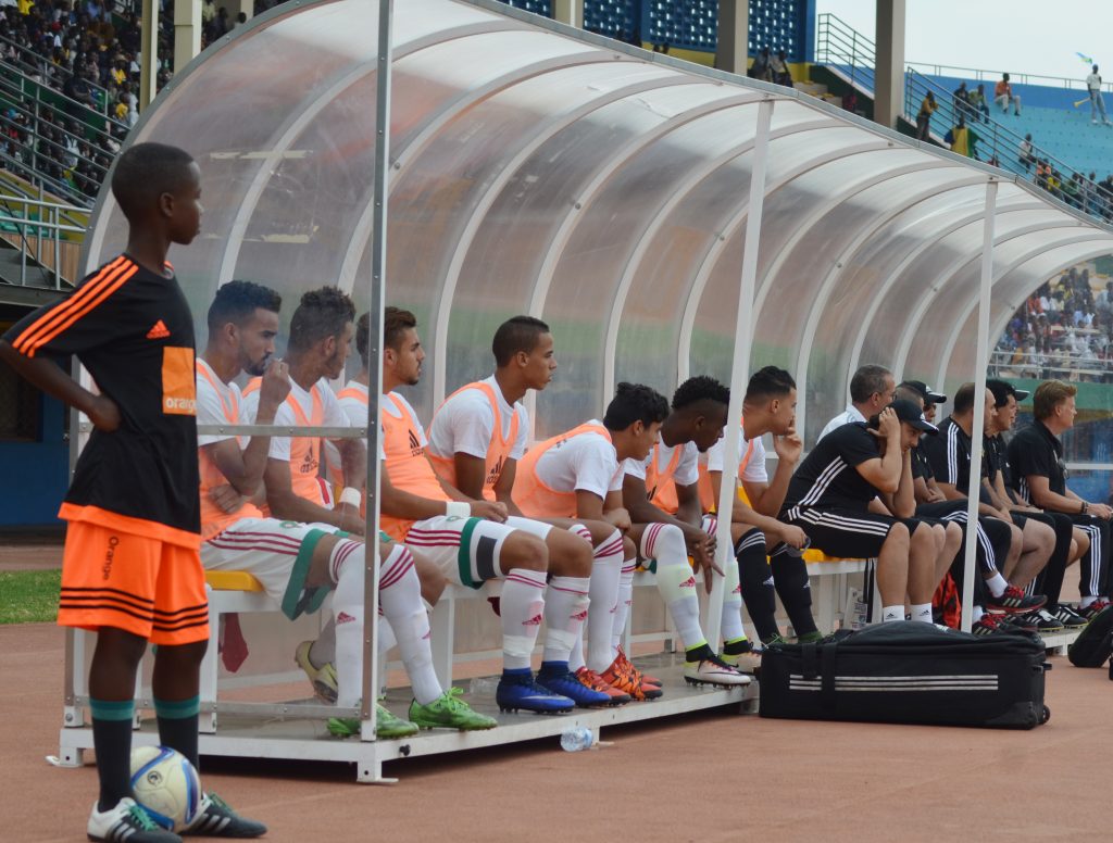 Morroc players sitting at the bench during the match