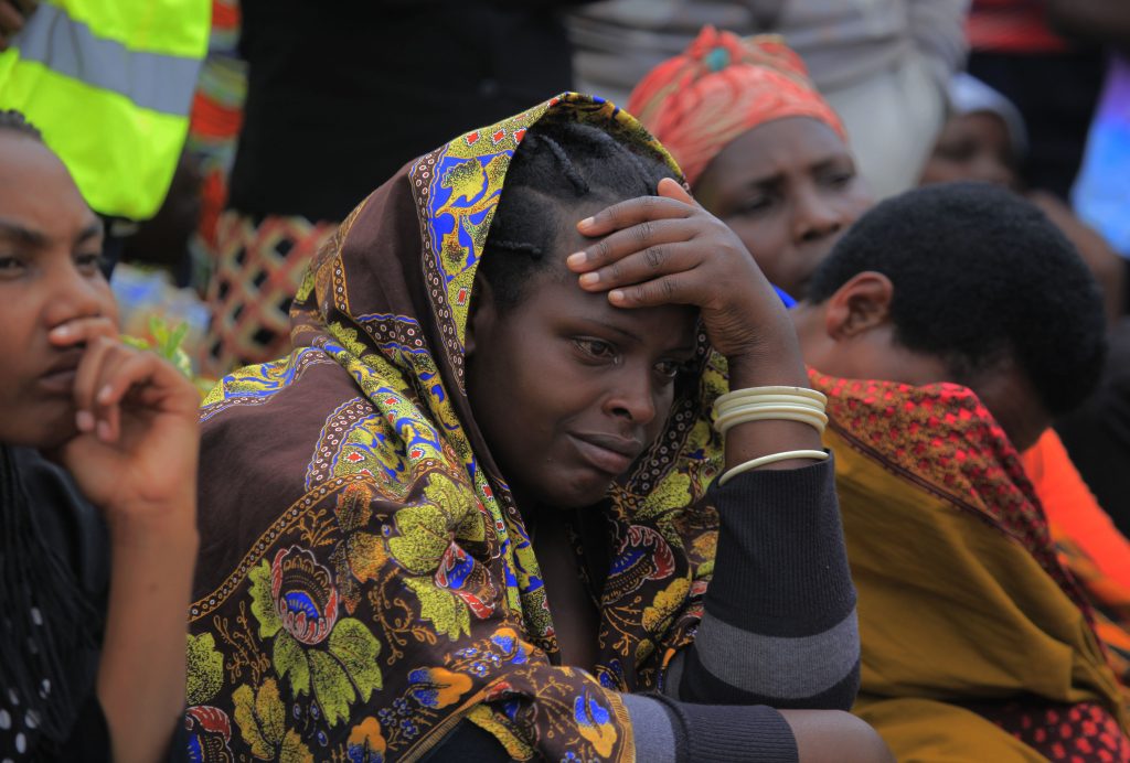 A genocide survivor in shock as she hears the testimony of the Tutsi slaughtered at Murambi in French military camp