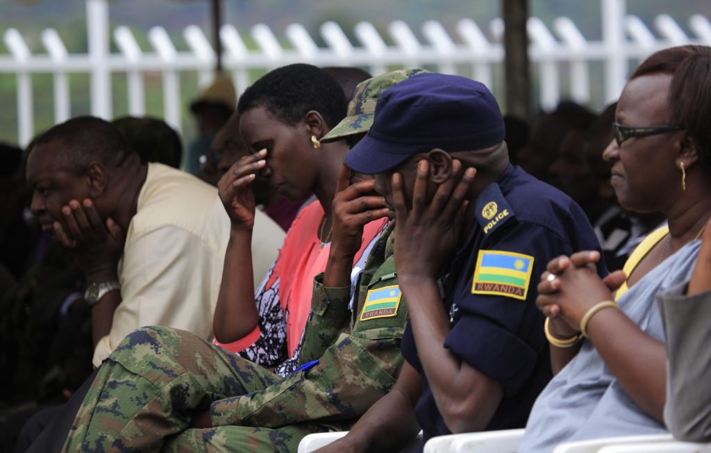 Officials listen to the moving testimony delivered by Simon Mutangana, a genocide survivor at Murambi Genocide Memorial